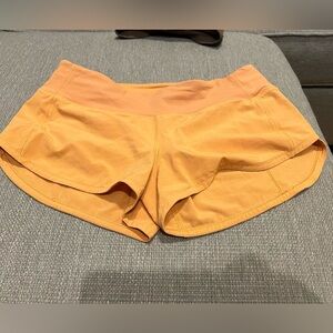 Lululemon Orange speed up size 4 regular.